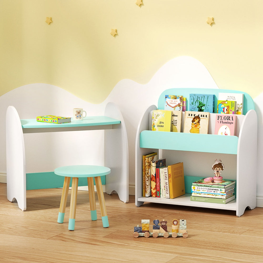 Children's desk and bookshelf set with books and toys in a room.