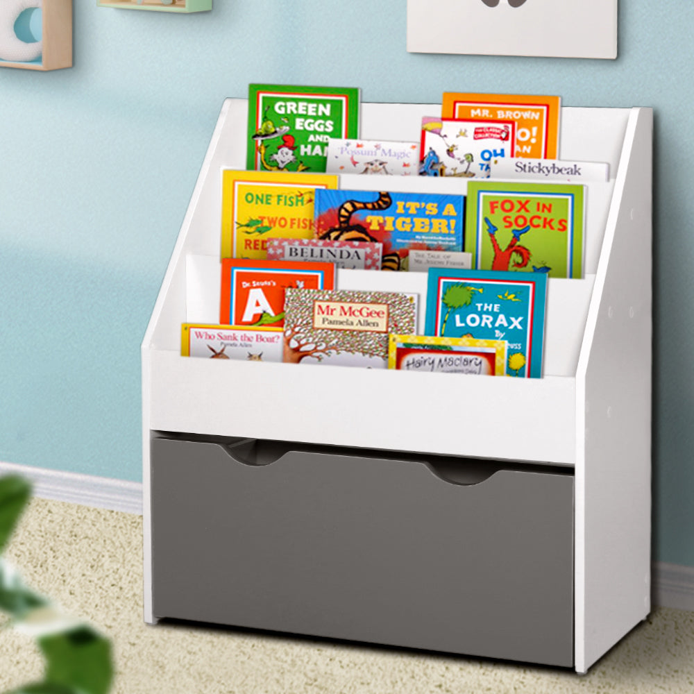 Children's bookshelf with books on a light blue wall