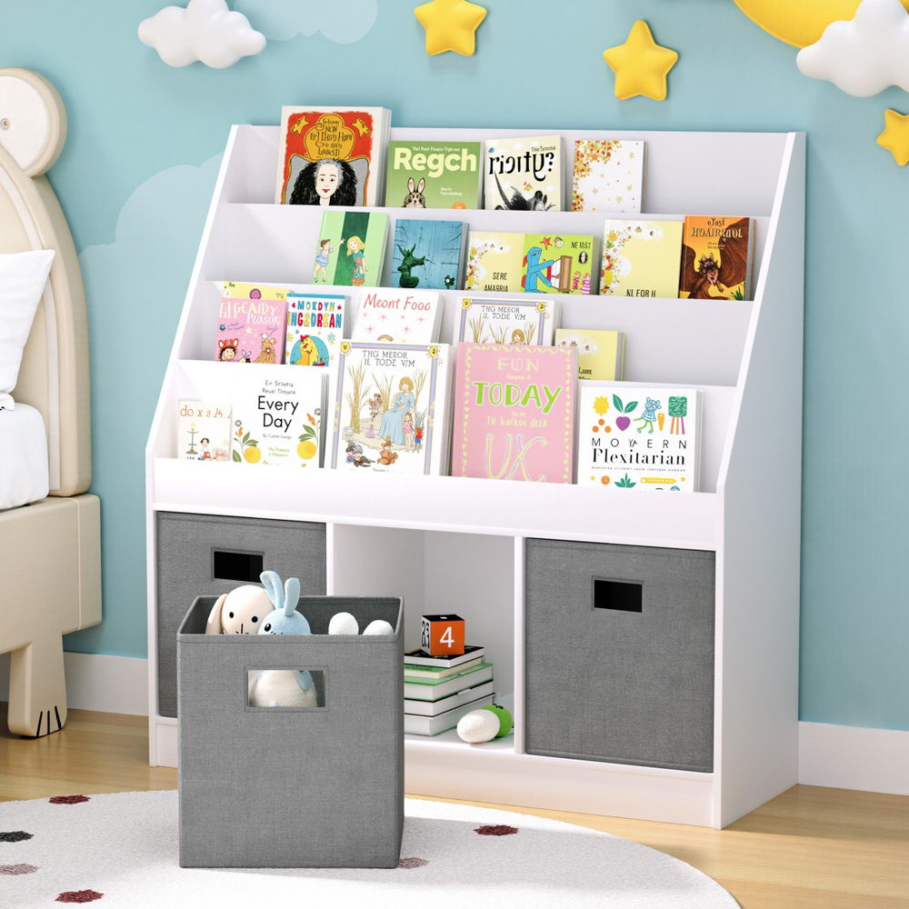 Children's bookshelf with books and toys against a light blue wall with star decorations.