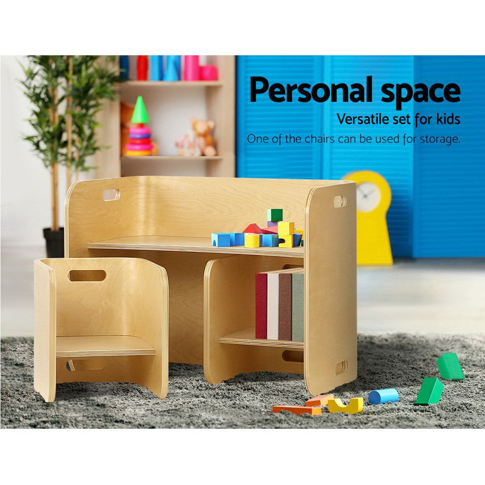 Children's wooden desk and chair set with toys and books in a room setting.