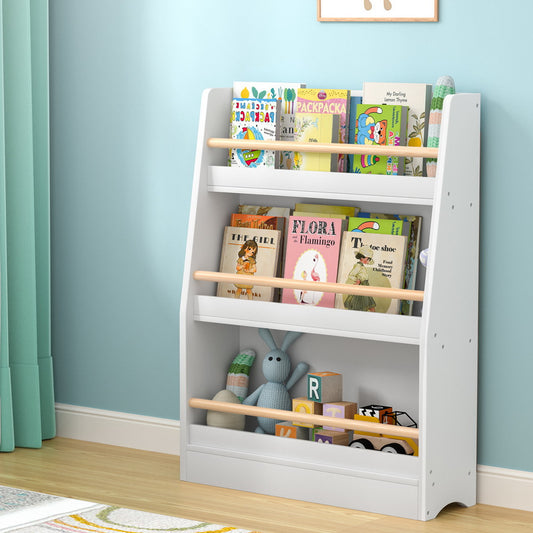 White children's bookshelf with books and toys against a light blue wall.