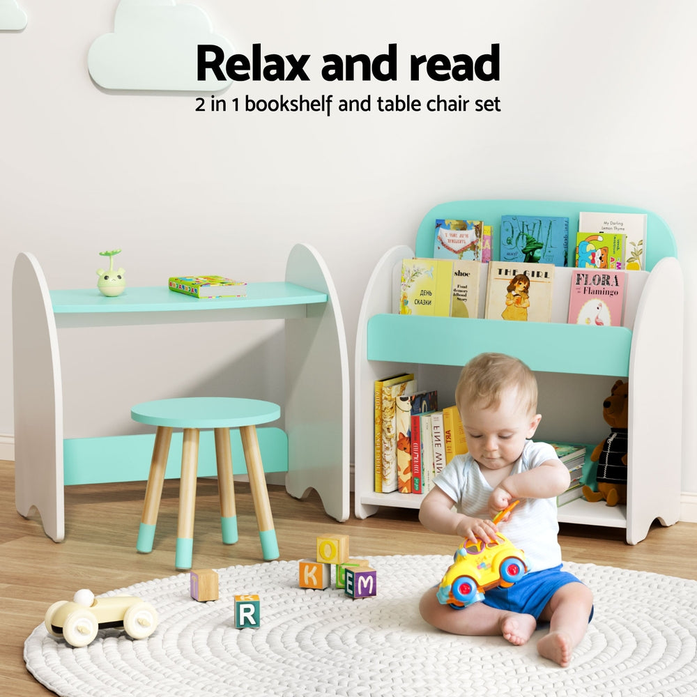 Children's table, chair, and bookshelf set with books and a child playing on the floor.