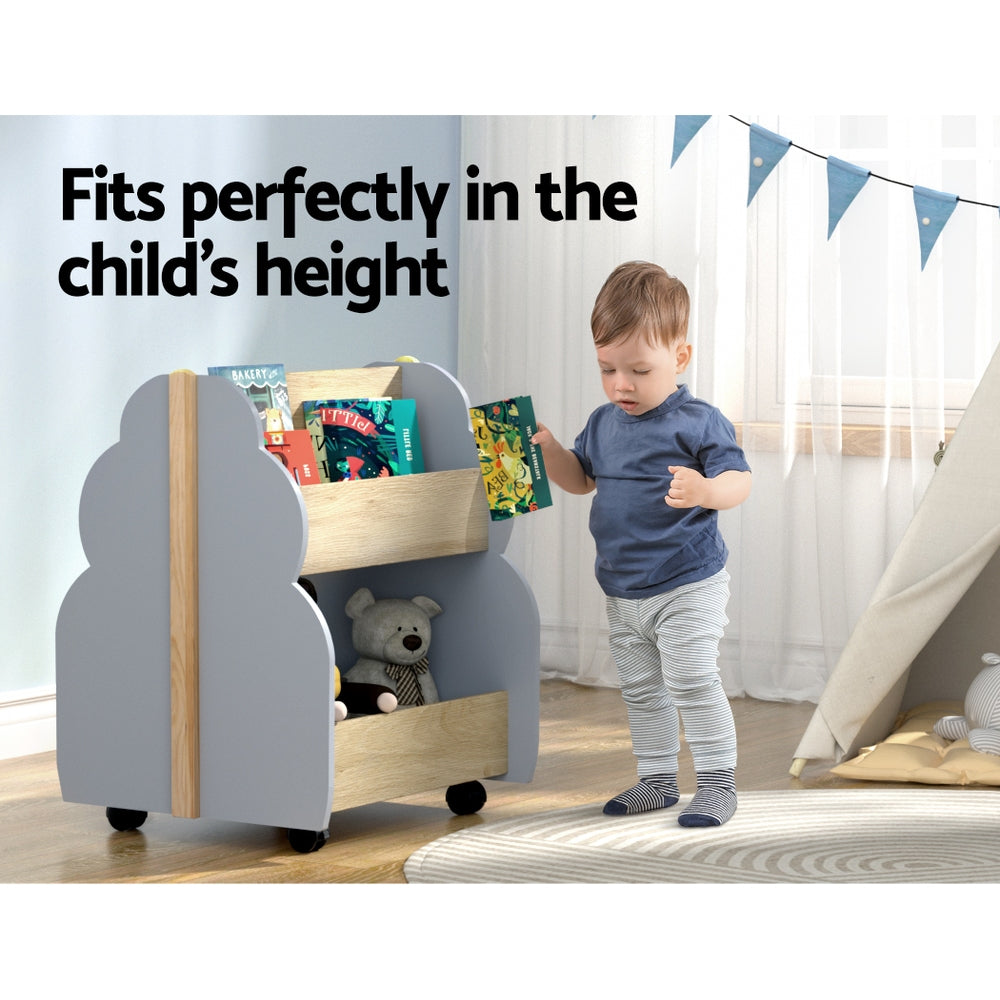 Child standing next to a gray children's bookshelf with books and toys, with text 'Fits perfectly in the child's height'.