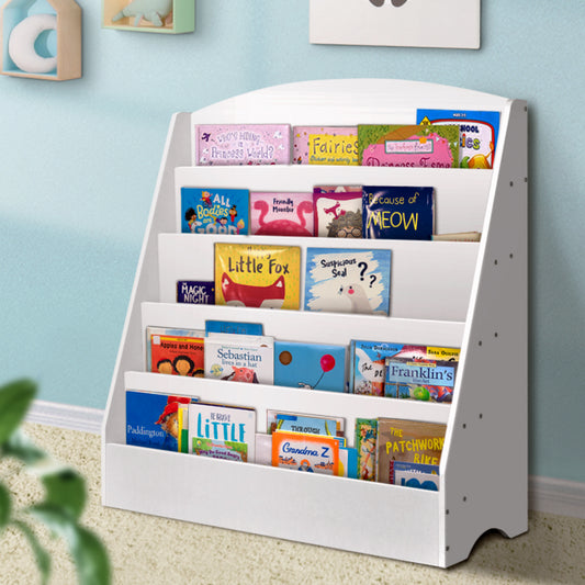 White bookshelf with children's books against a light blue wall.