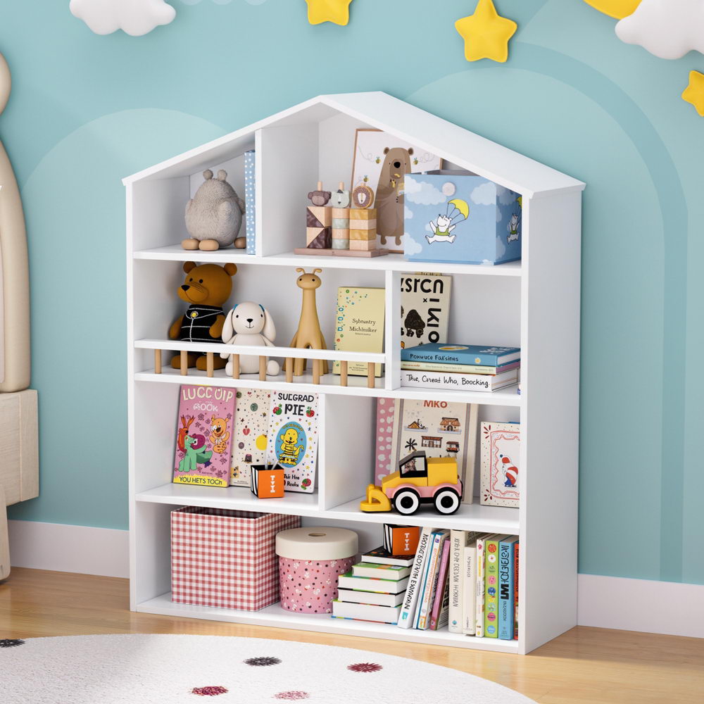 White children's bookshelf with toys and books against a blue wall with star decorations.