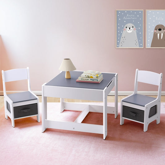 Children's table and chairs set with storage bins in a room with wall art.
