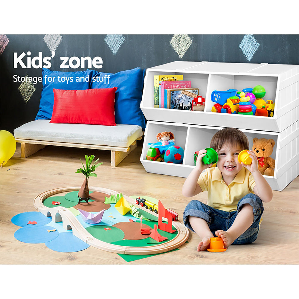 Child playing with toys in a room labeled 'Kids' zone' with storage for toys.