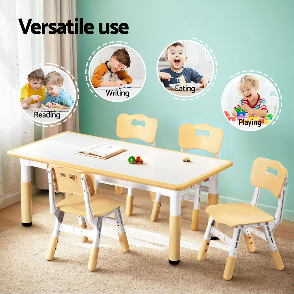 Children's table and chairs set with various activities depicted on a light green wall.