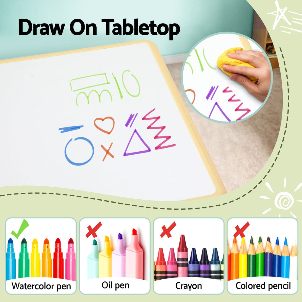 Tabletop drawing activity with colorful markers and a hand using a yellow eraser.
