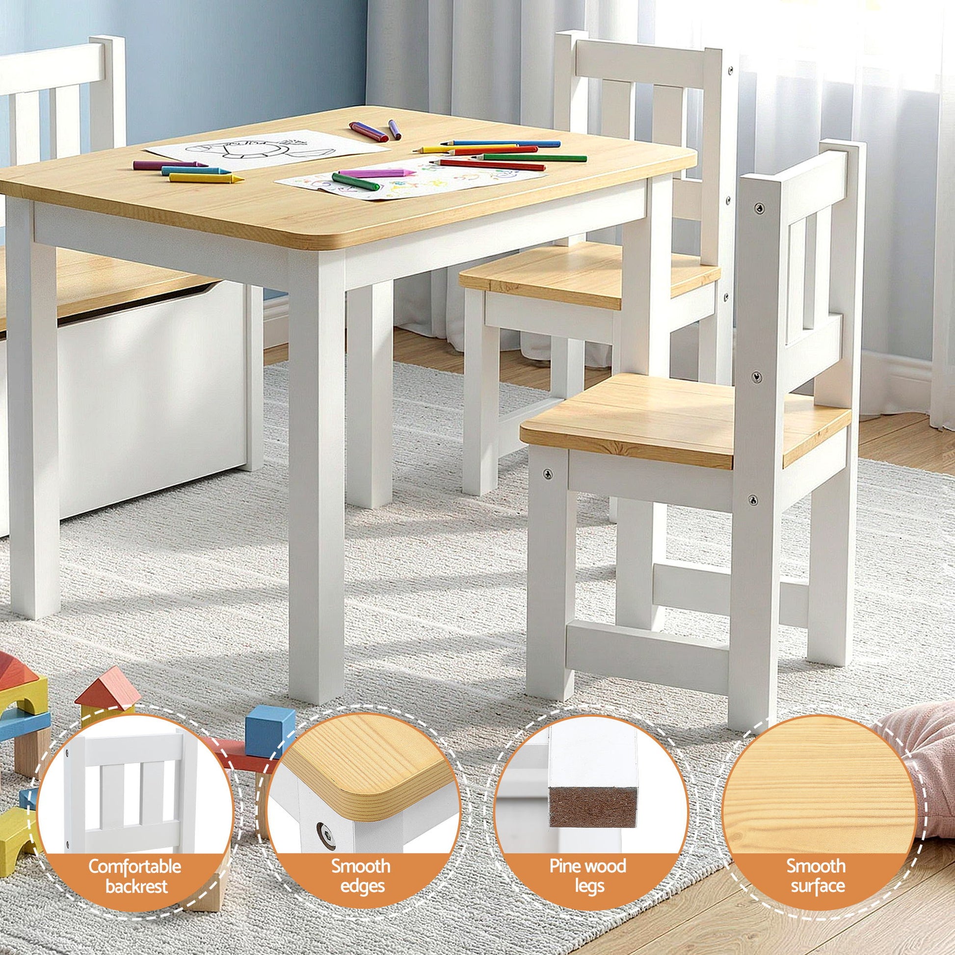 Children's table and chairs set with wooden surface and white frames in a room.