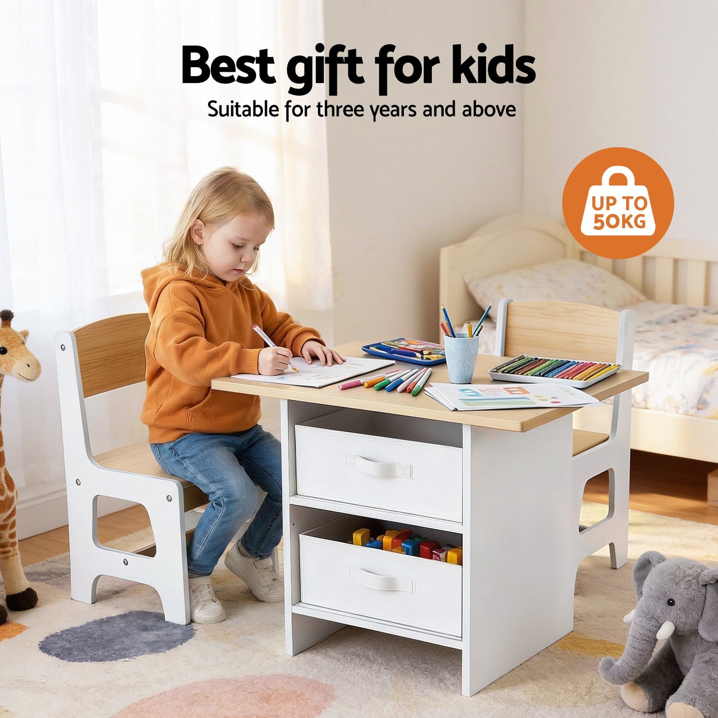 Child sitting at a small wooden desk with coloring supplies, surrounded by toys in a room.