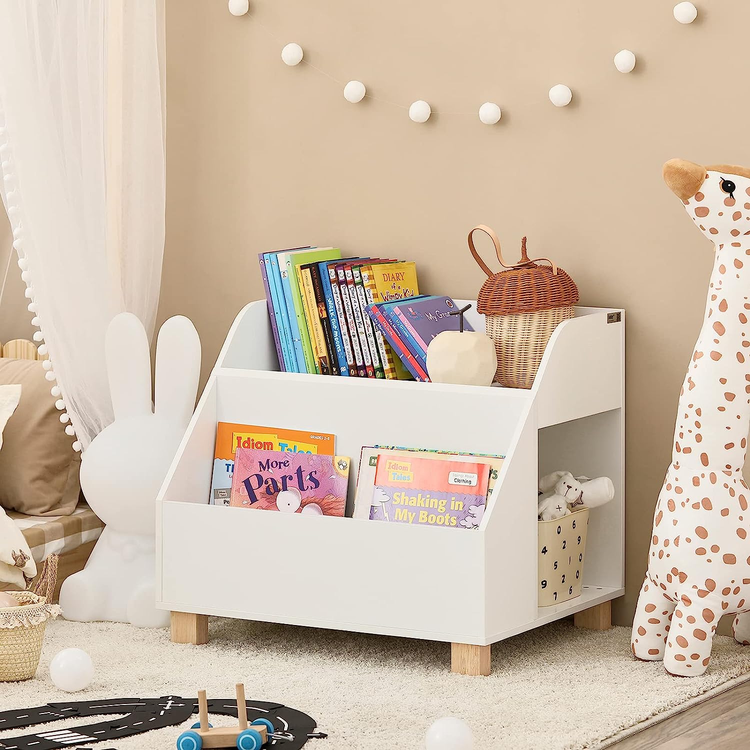 Children's bookshelf with books and toys in a room setting