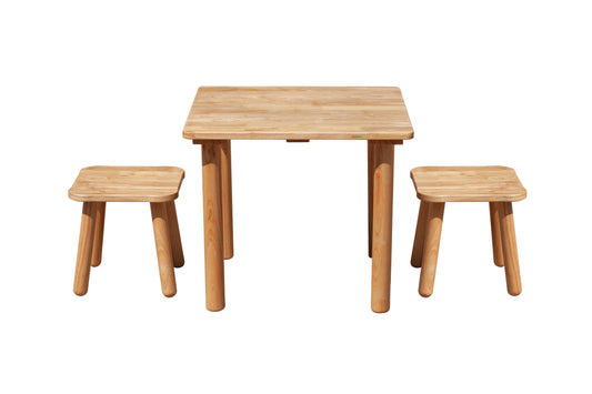 Wooden children's table and two stools on a white background